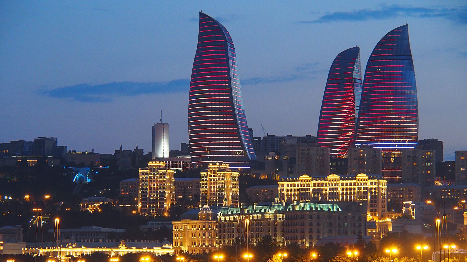 Flame Towers at night with LED fire effects lighting up Baku skyline
