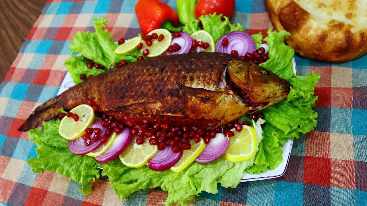 Balyg grilled Caspian fish dish served with onions walnuts and spices